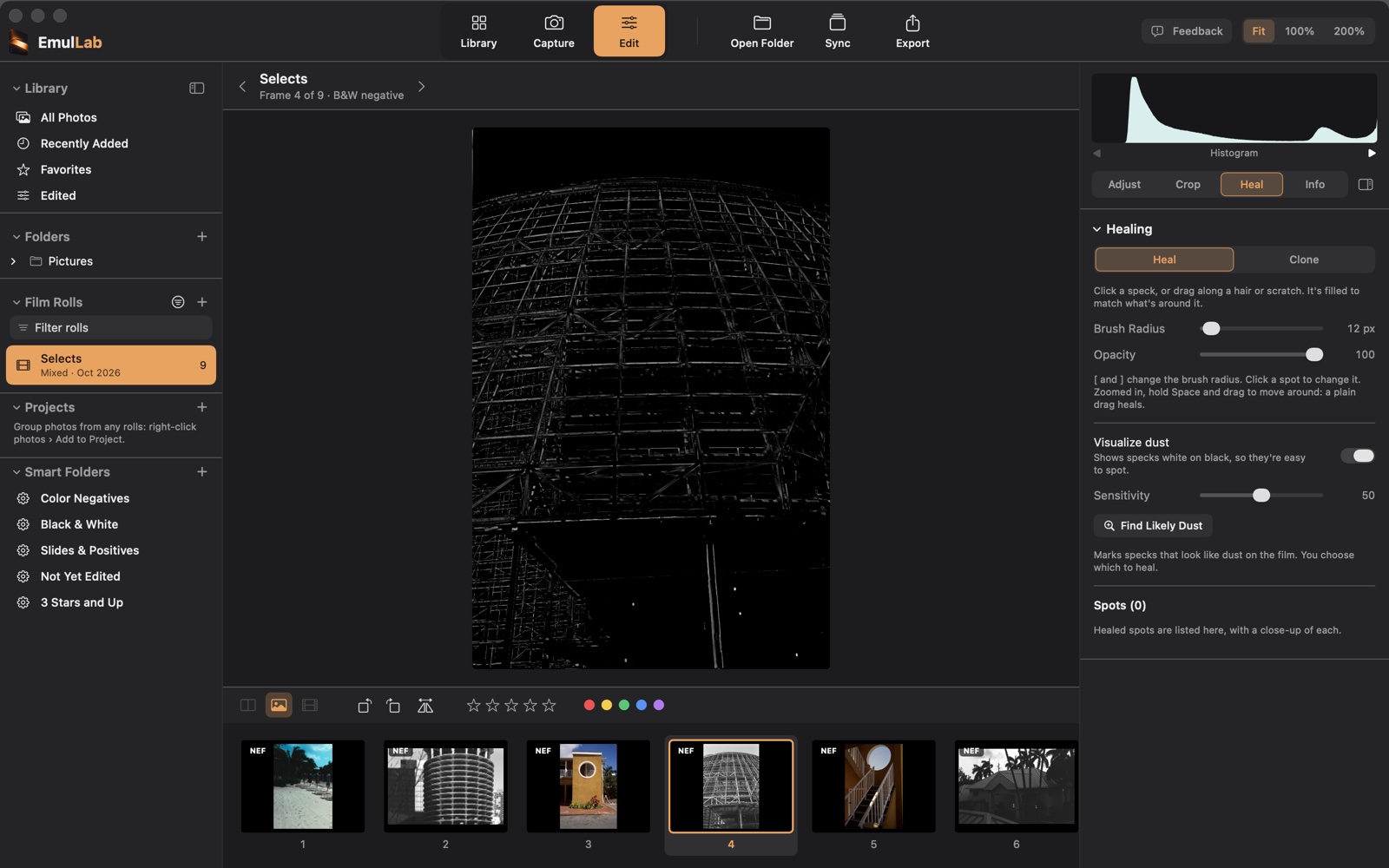 Visualize dust on: the same frame as a dust map, the steel frame faint gray on black and a few specks white